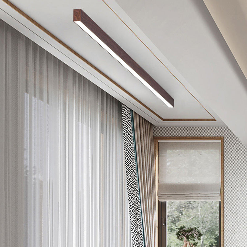 Slim wood grain LED ceiling bar highlighting a clean interior