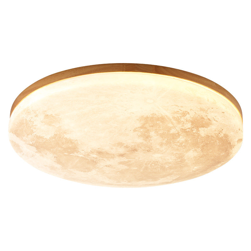 Slim side profile of the moon flush mount light sitting close to the ceiling