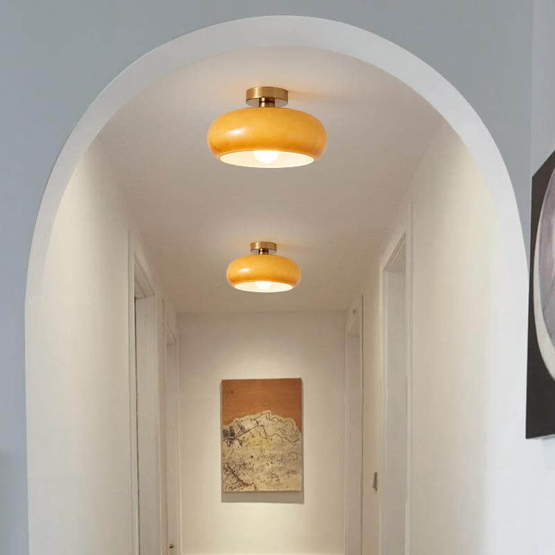 Amber glass ceiling light shade viewed from a low front angle