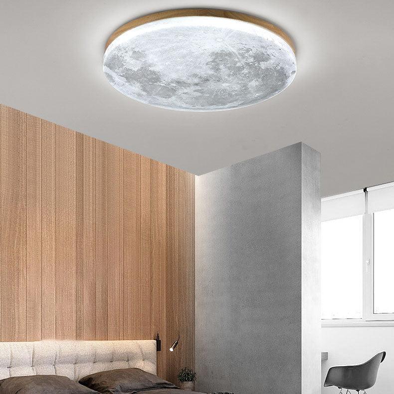 Moon round LED flush mount ceiling light glowing warmly in a hallway