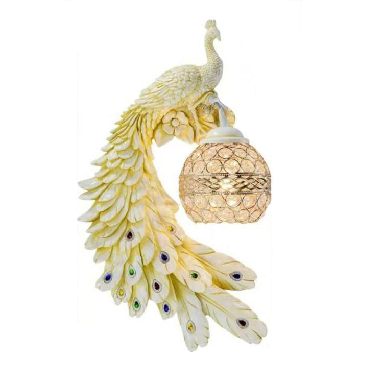 Cream peacock wall sconce facing left with a sculpted flowing feather tail