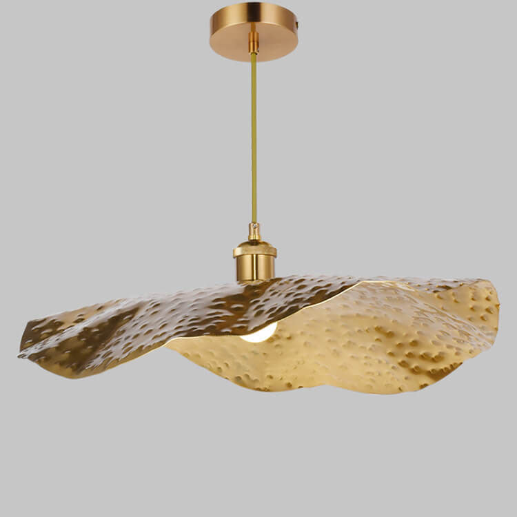 Row of hammered gold leaf pendants lighting a contemporary tea room