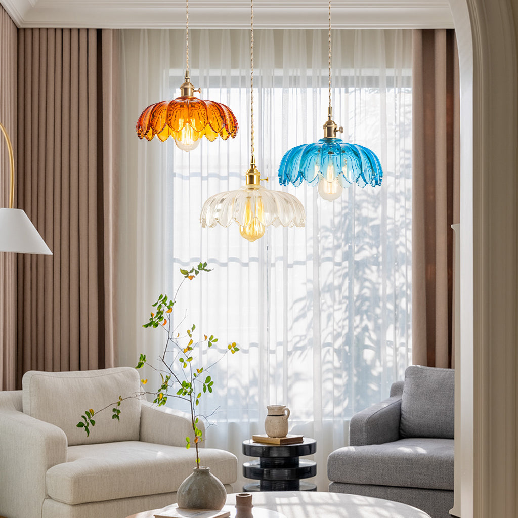 Tulip glass pendant light lit against a dark backdrop