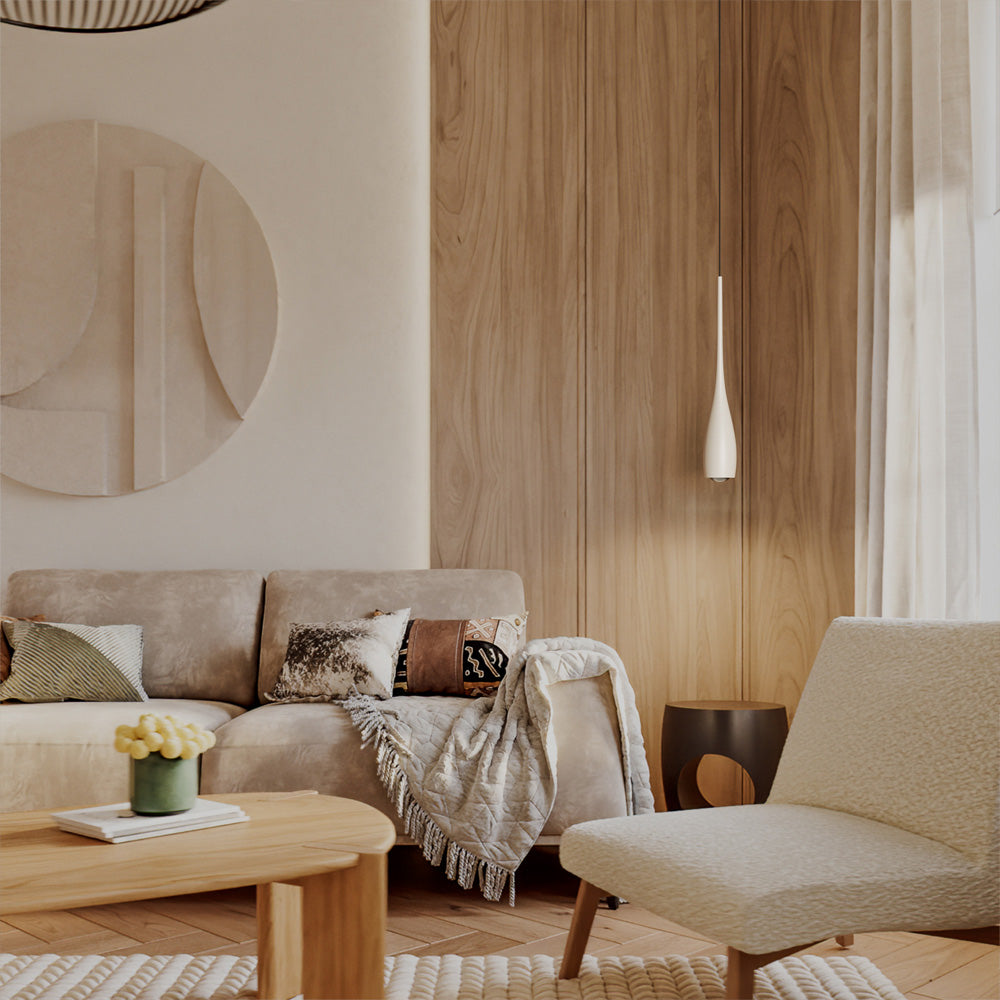Water drop pendant light adding a warm glow to a living room