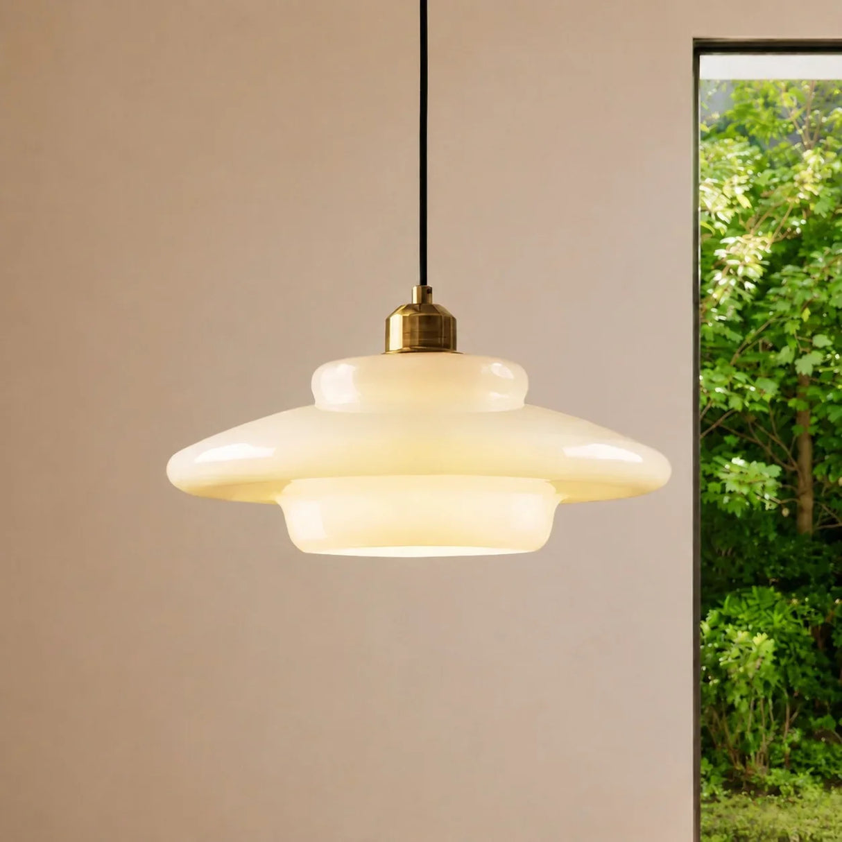 Cream opal glass pendant light glowing warmly