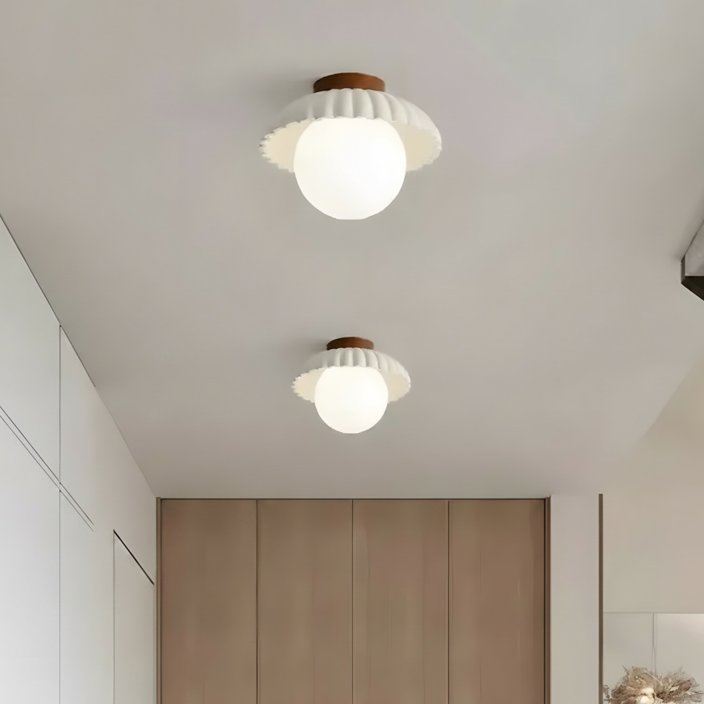 Close view of the ruffled petal shade above the round opal glass diffuser
