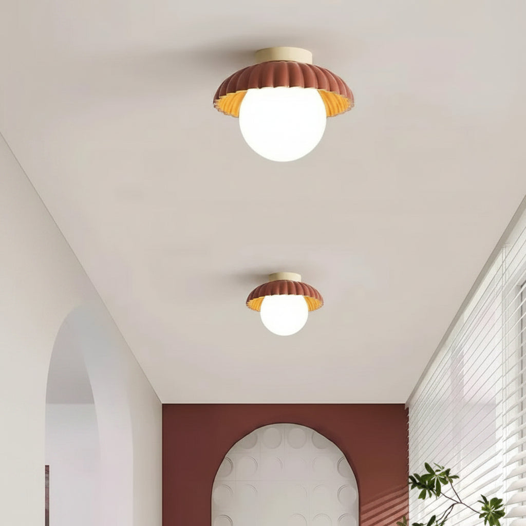 Angled view of the cream flush mount ceiling light and metal canopy