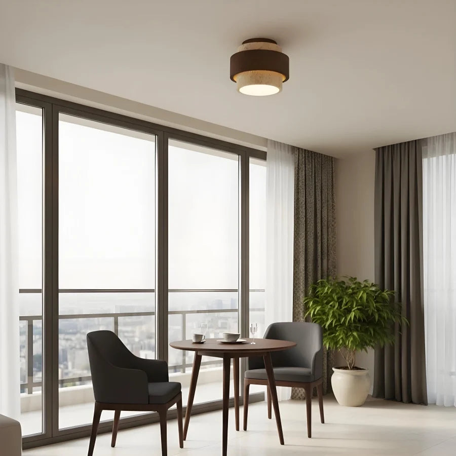 Rear three-quarter view of the tiered travertine flush mount fixture