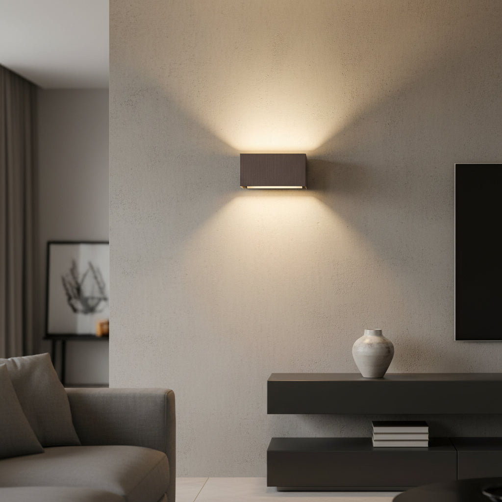 Coffee gold finish LED wall sconce displayed on a light background