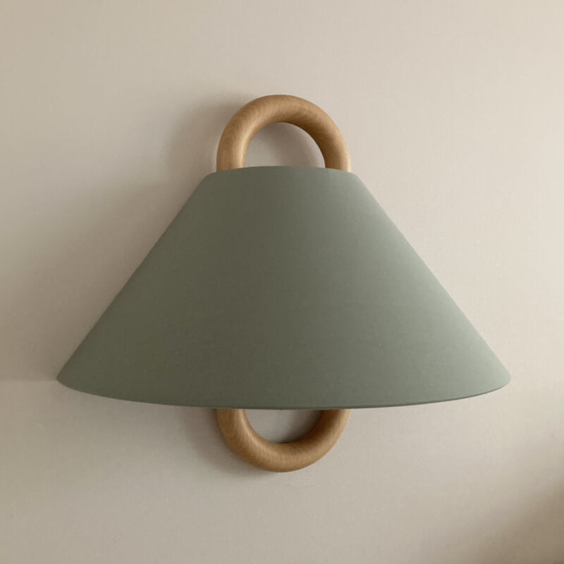 Fabric wall sconce shown in one of six colour options