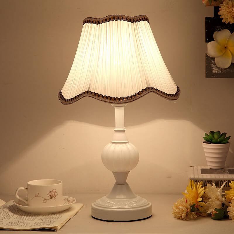 White fluted glass base lamp with plain pleated fabric shade