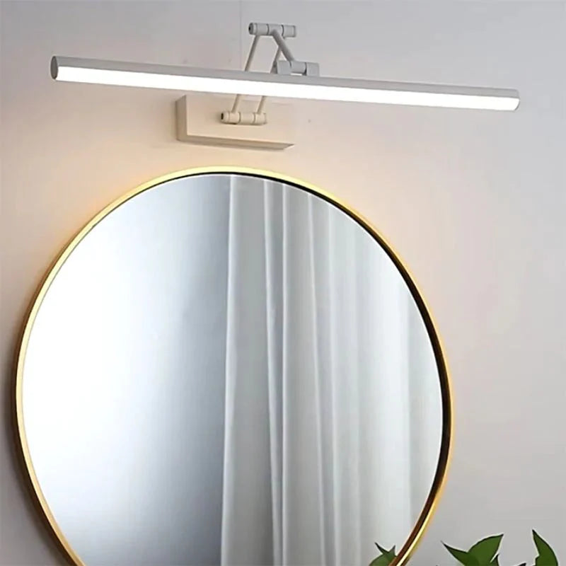 Adjustable vanity light bar tilted to aim light at the sink