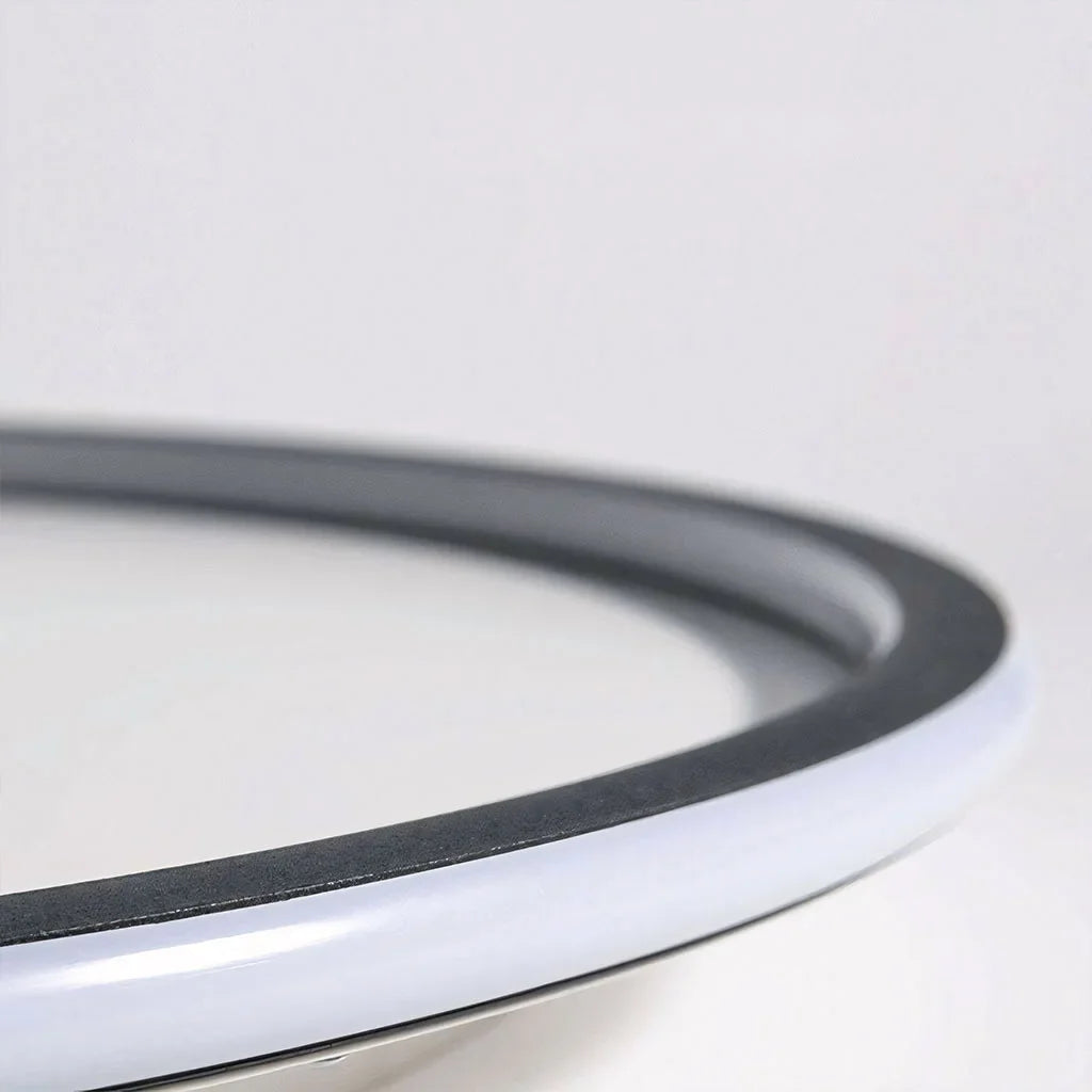 Side detail showing the low flush mount profile of the ceiling light