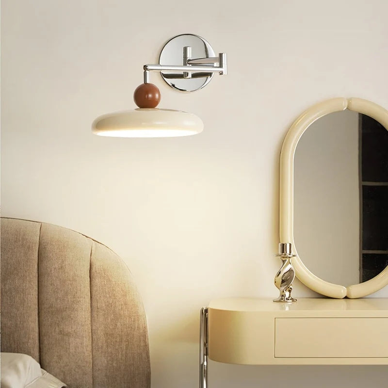 Adjustable wall lamp extended fully to show the reach of the arm
