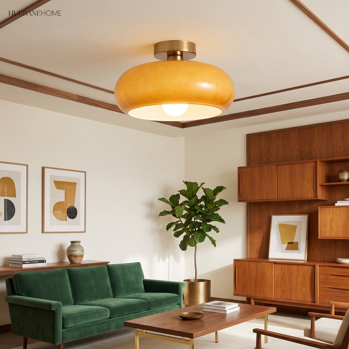 Amber glass ceiling light glowing above a mid-century green velvet living room