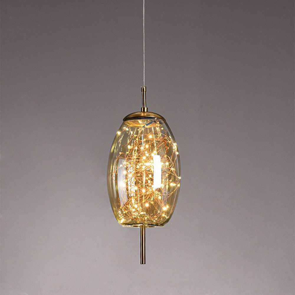 Oval amber glass shade lit by a starry LED cluster on a brass stem