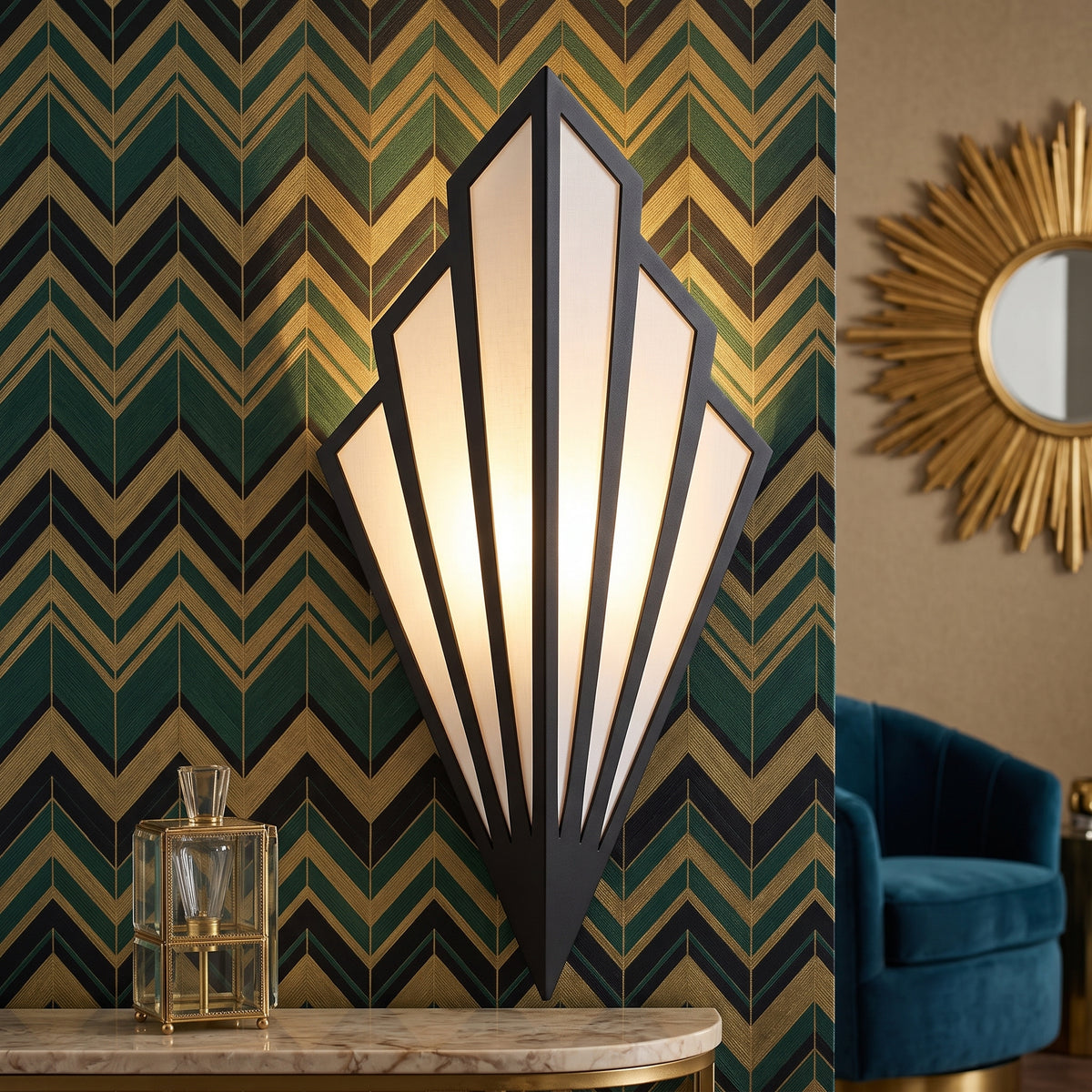 Lit fan shaped sconce on a green and gold chevron patterned wall