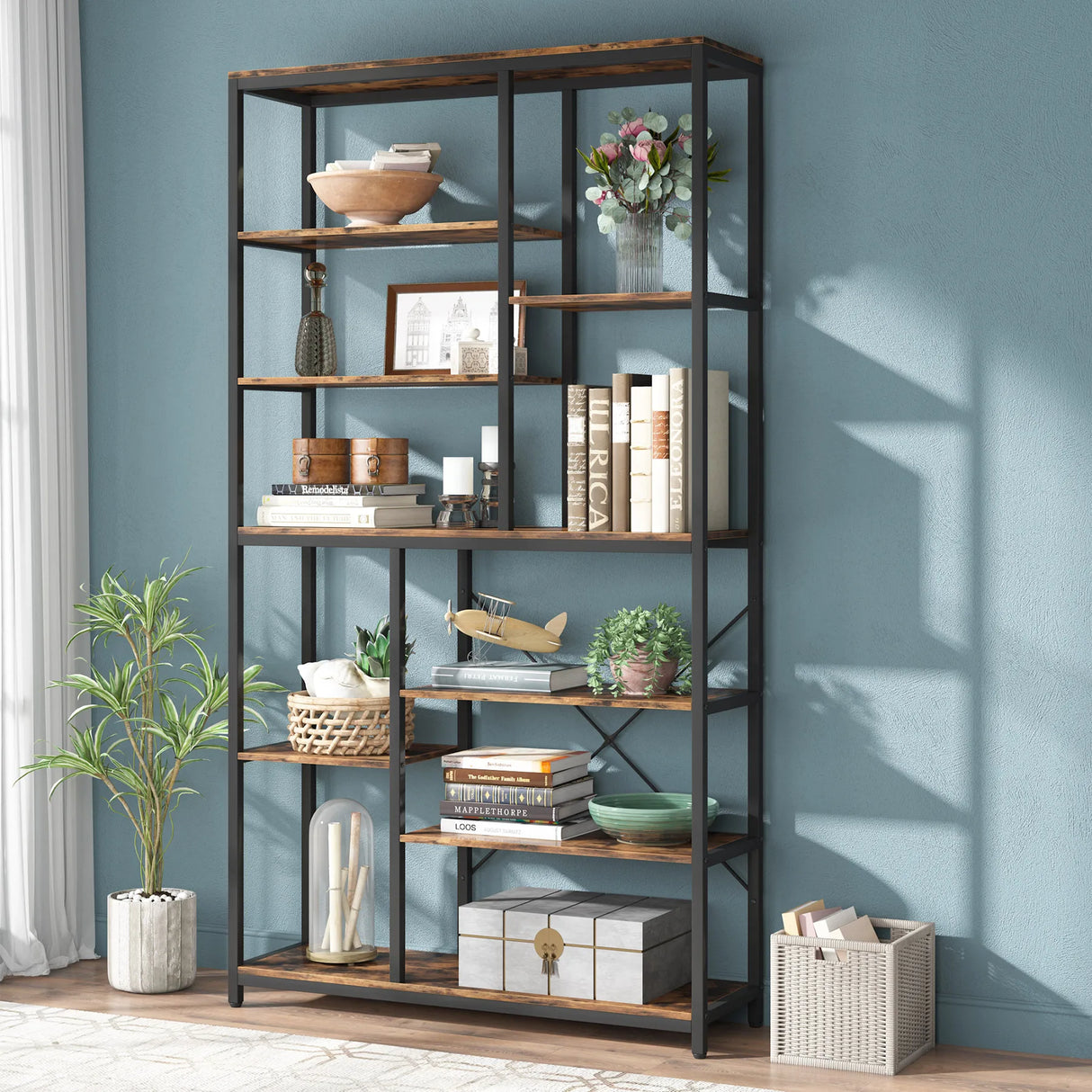 Backless bookshelf showcasing decorative books and plants