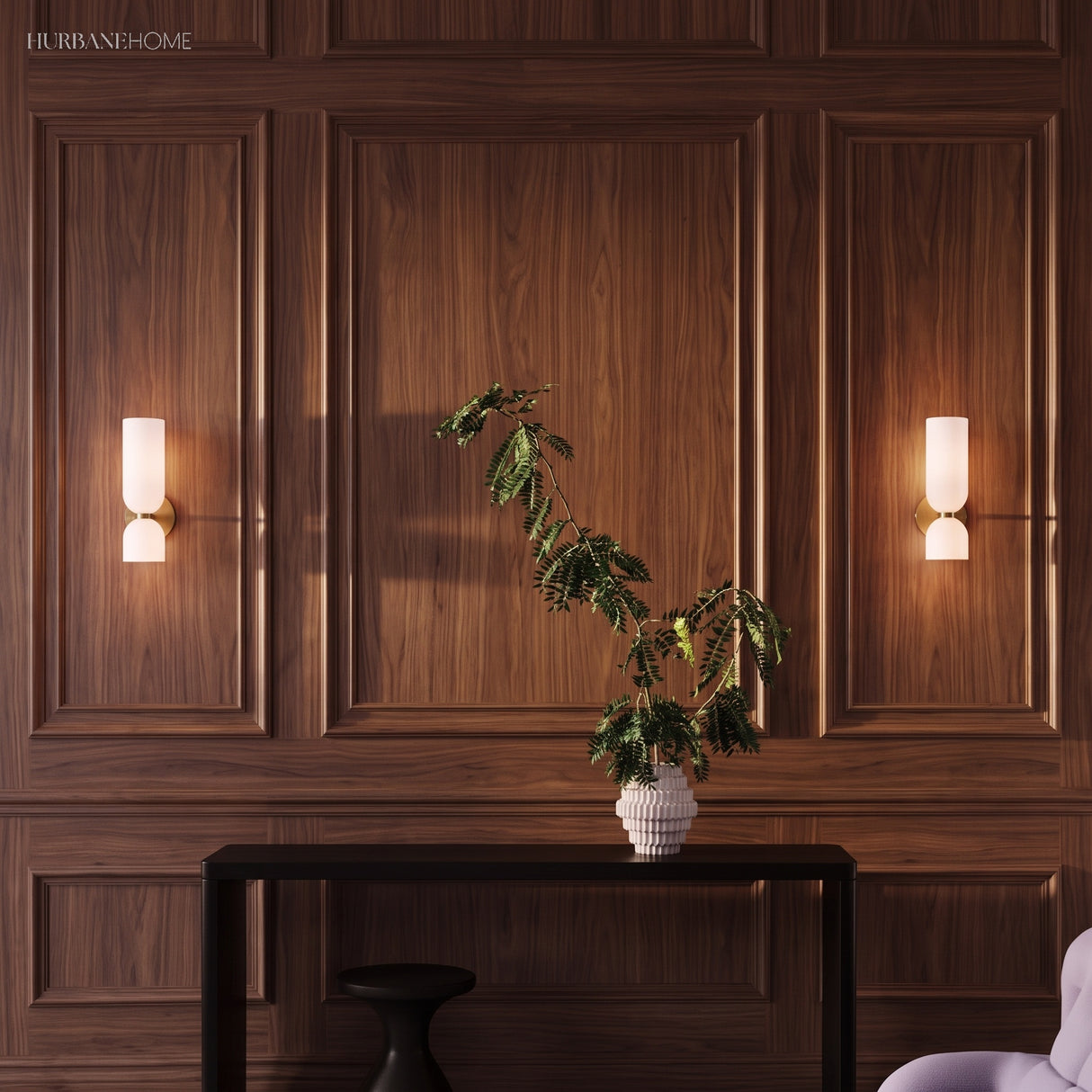 Pair of glass wall sconces on a walnut panelled wall above a console table