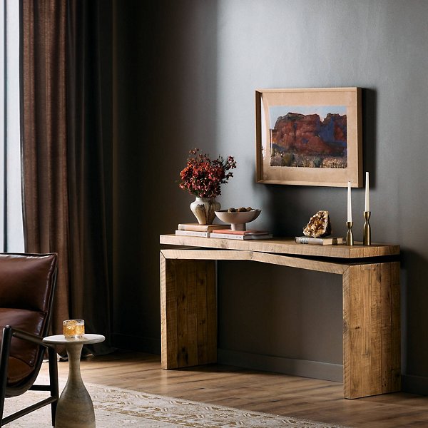 Contemporary interior with a sleek dark wood console table