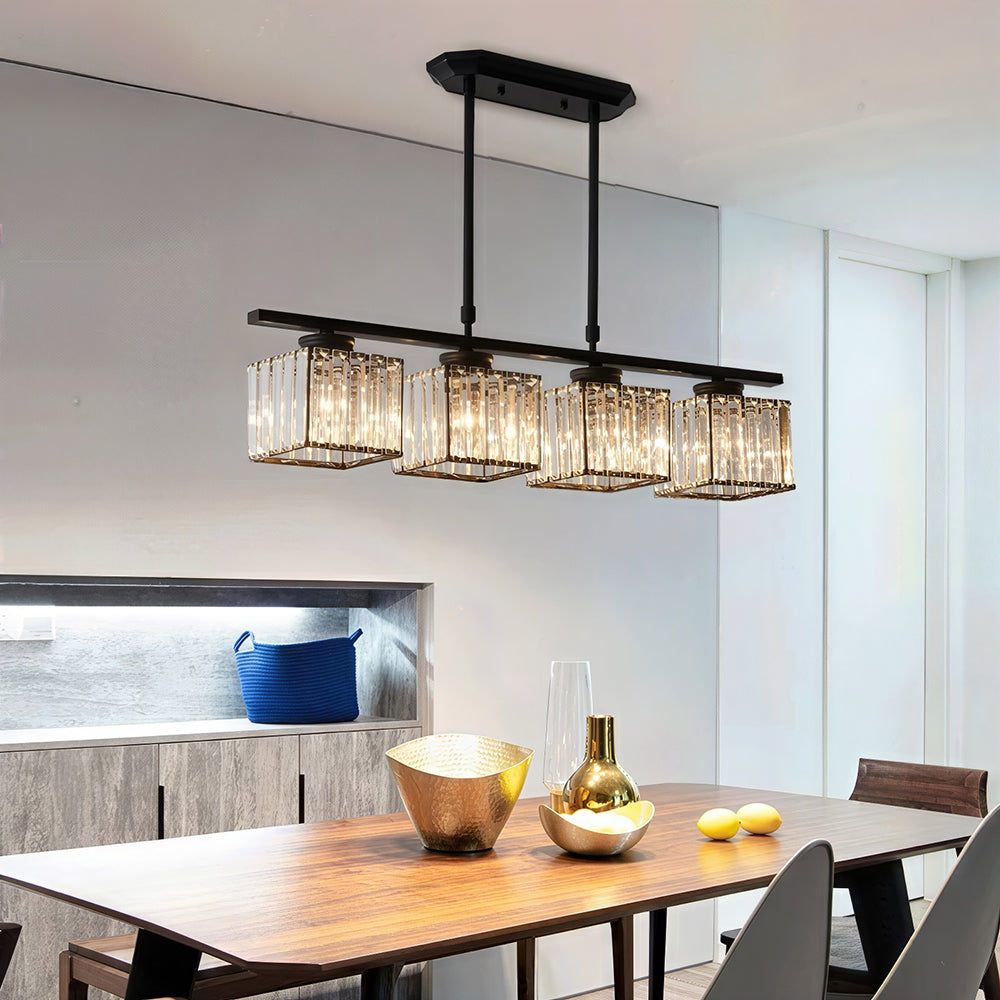 Four faceted glass shades on a black bar lighting a modern dining room