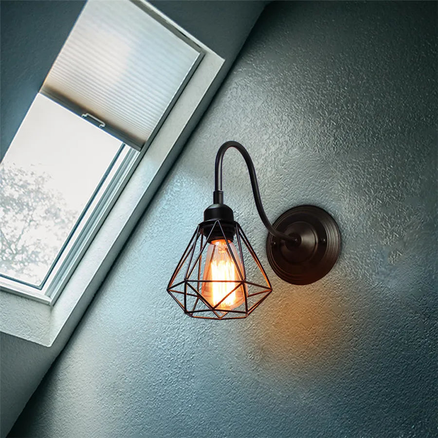 Black metal cage wall light single piece mounted on interior wall