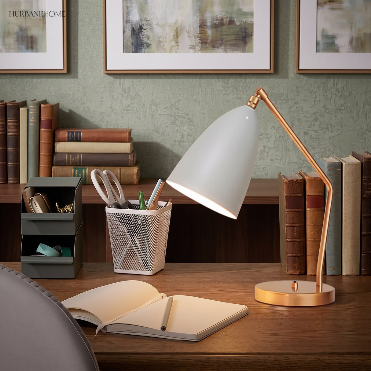 Brass table lamp with matte cone shade on a desk