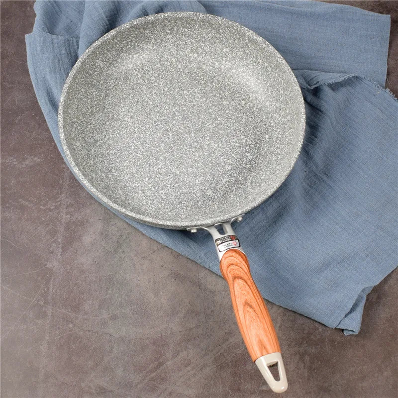 Ceramic coated nonstick cookware wok pan on induction stovetop