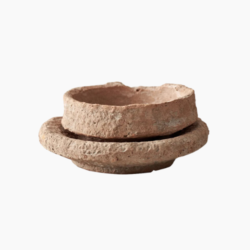 Rustic ceramic flower vase on wooden tabletop