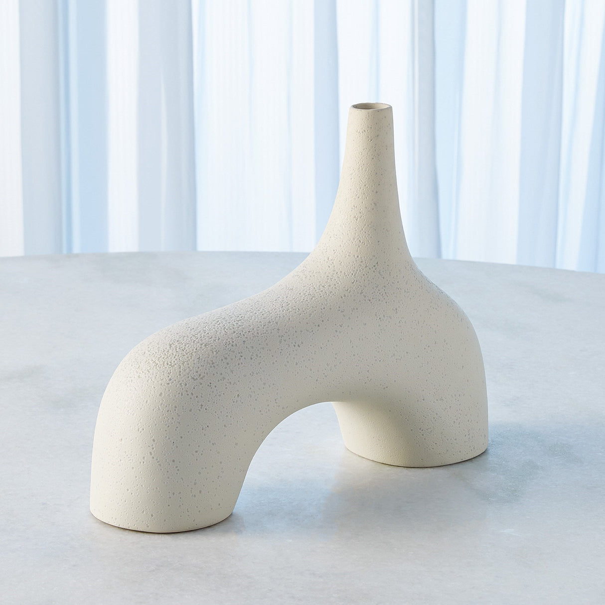 Cream stone décor styled as ceramic hollow vase on dining table