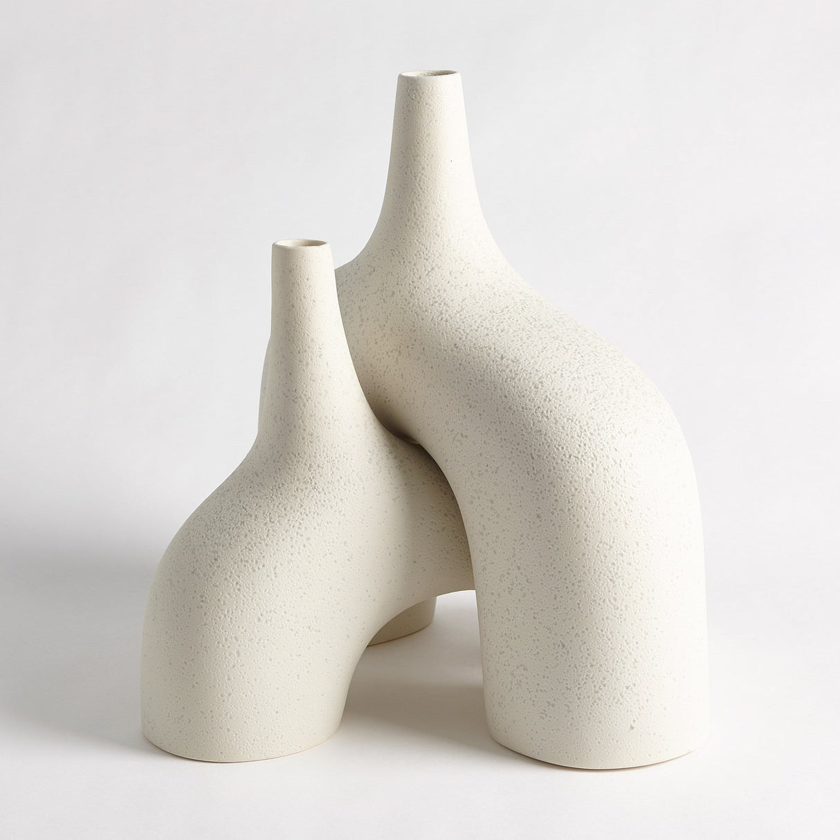Textured cream accent displayed as ceramic stoneware vase on shelf