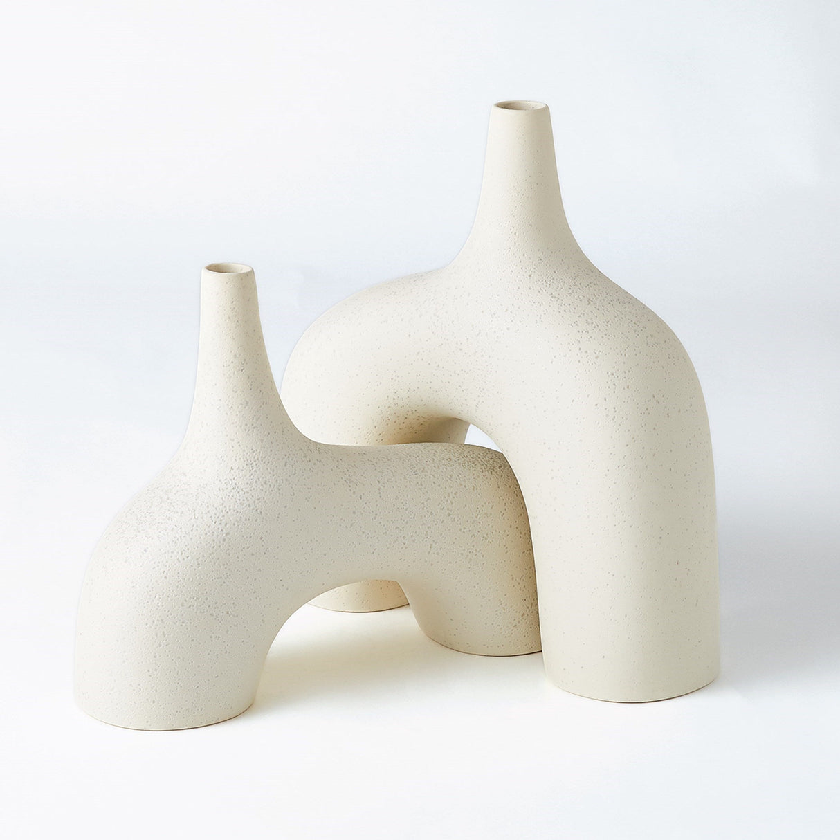 Sculptural tabletop piece shown as ceramic vessel vase in modern interior