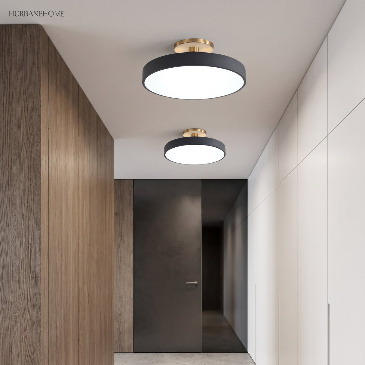 Two circular ceiling lights along a timber lined hallway