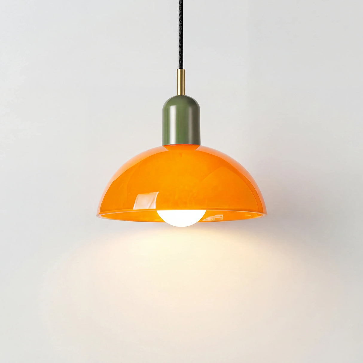 Colorful glass bowl pendant light shown in several bold shade colours