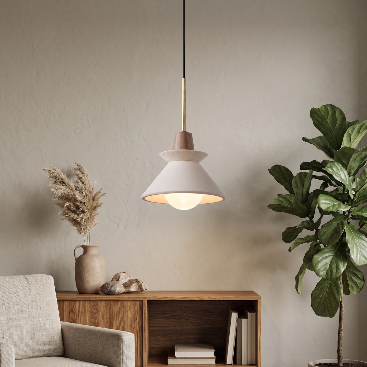 White cement cone pendant lit above a console table and dried grasses