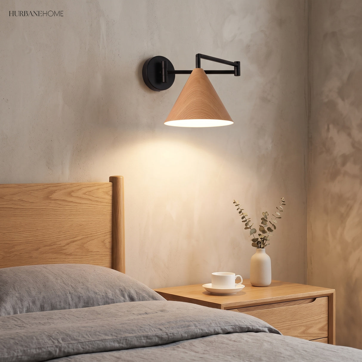 Cone shade swing arm wall sconce in a styled bedroom