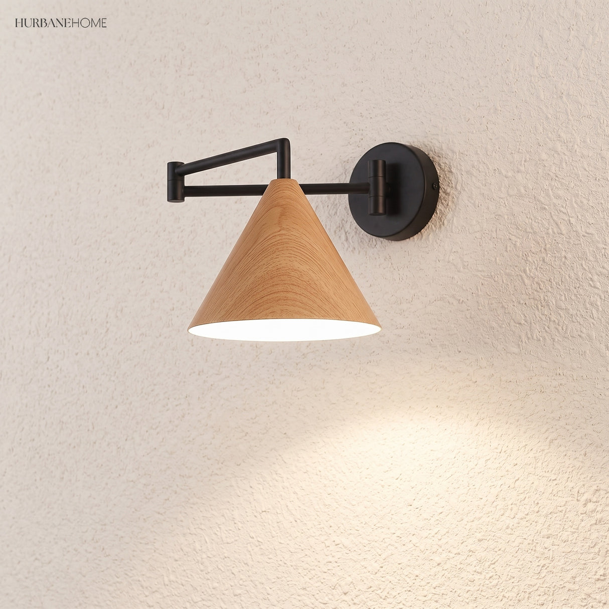 Cone shade swing arm wall sconce on a textured wall