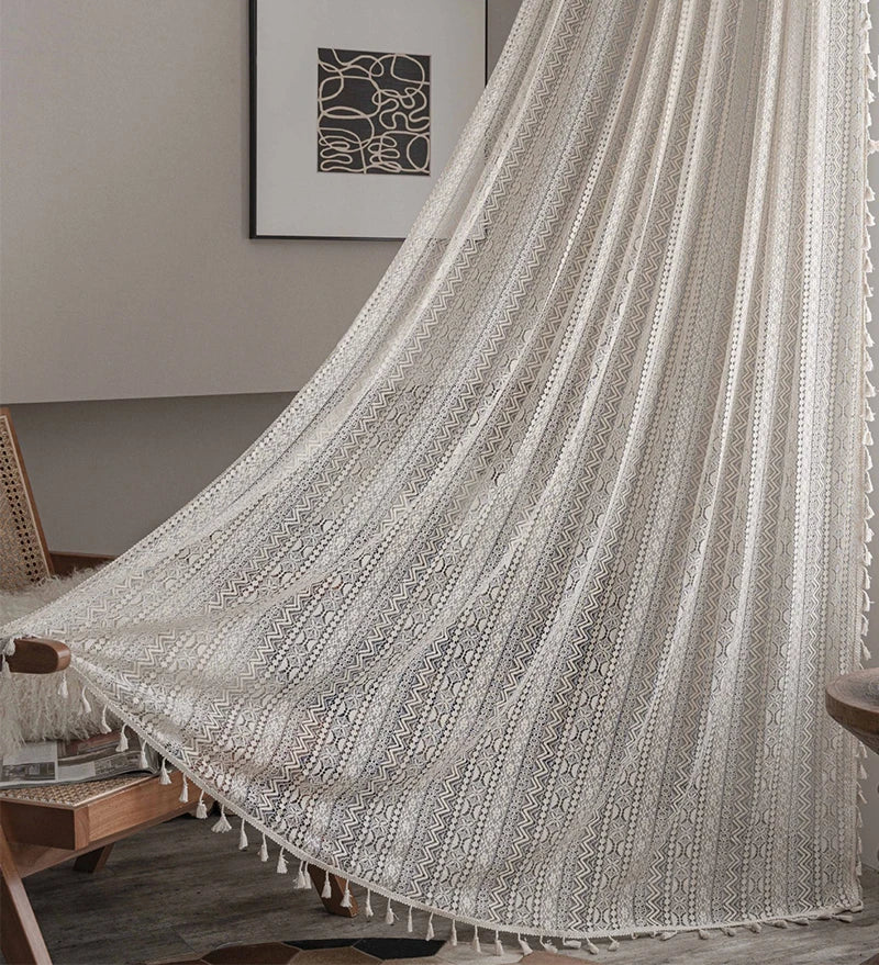 Cotton crochet lace curtains draped over café-style window opening