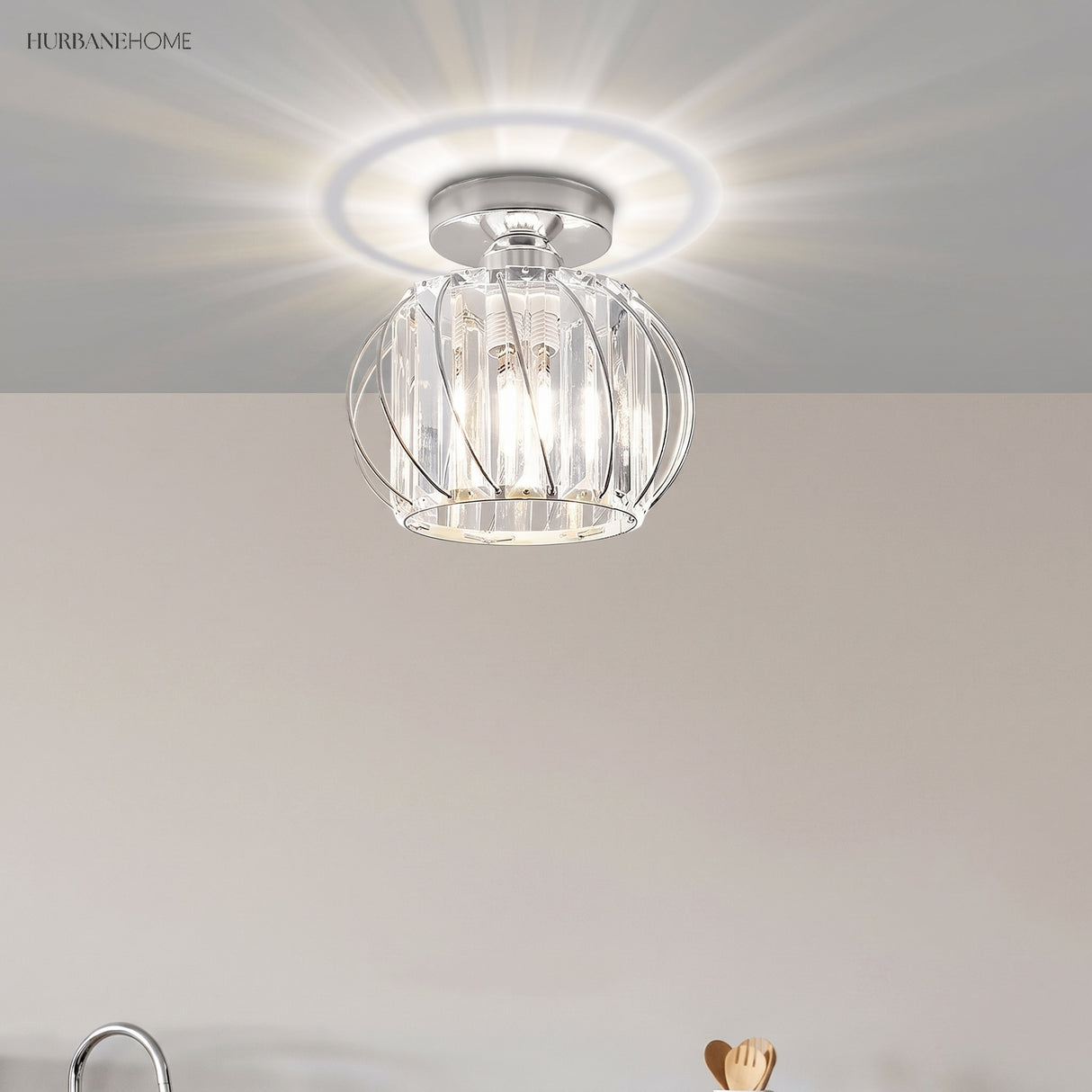 Chrome finish crystal cage ceiling light casting a bright ring of light
