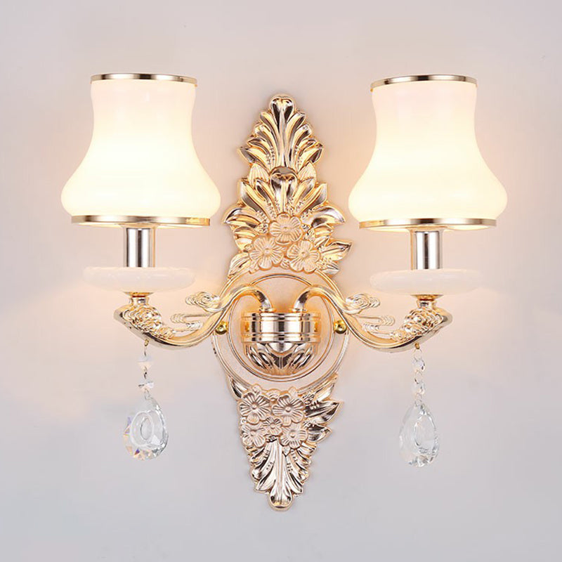 Silver two light sconce with opal glass shades and crystal drops