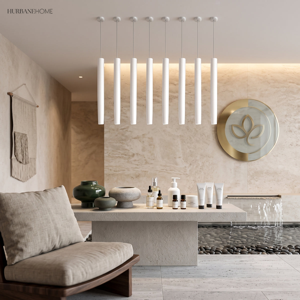Row of white tube pendants above a pale stone kitchen island