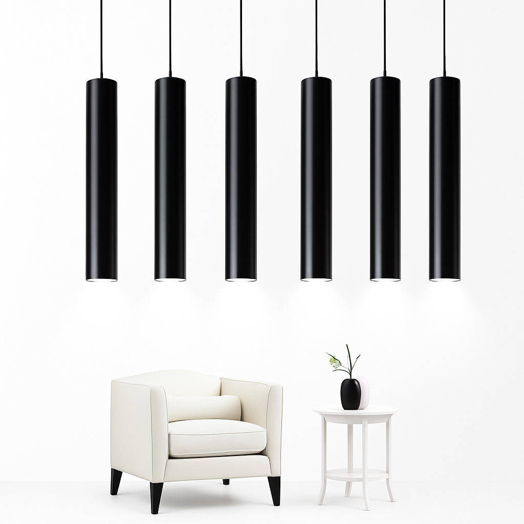 Six black tube pendants at staggered heights above an armchair