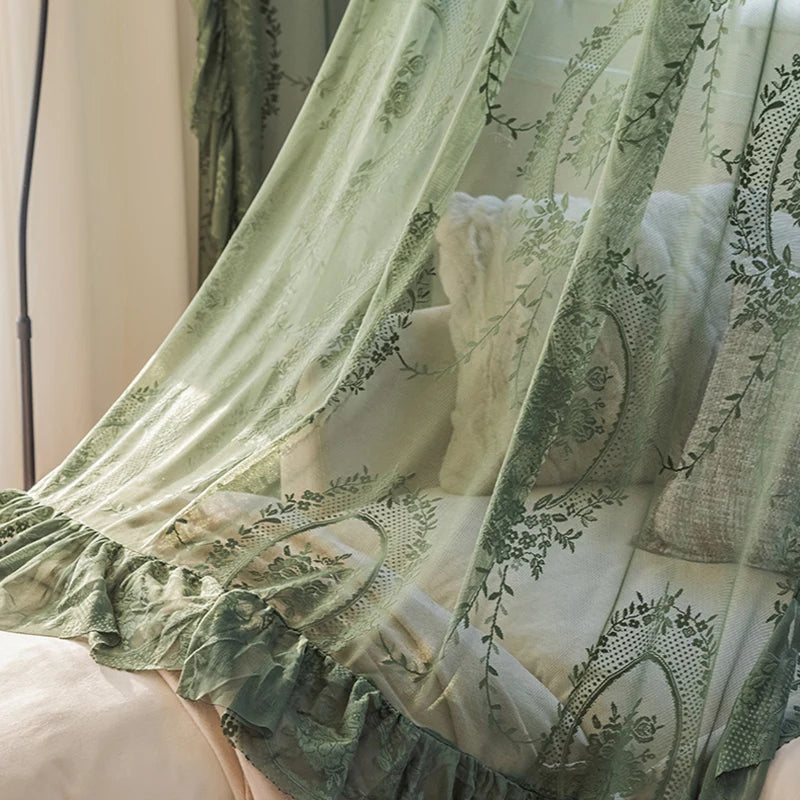 Dark green floral embroidered sheer curtains with ruffle top in a cozy bedroom, adding elegance and privacy.