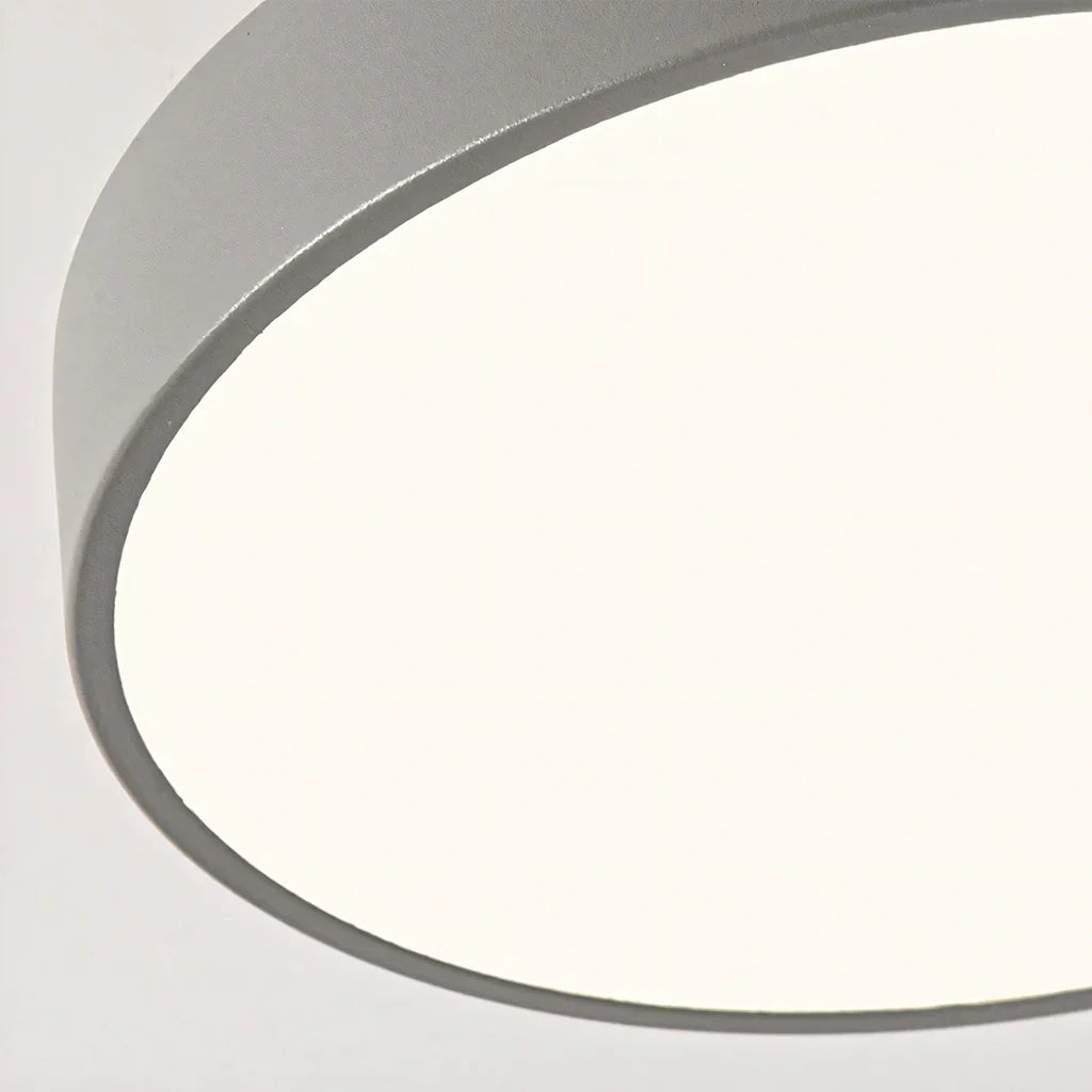 Detail view of the round wood ceiling light frame and painted drum edge