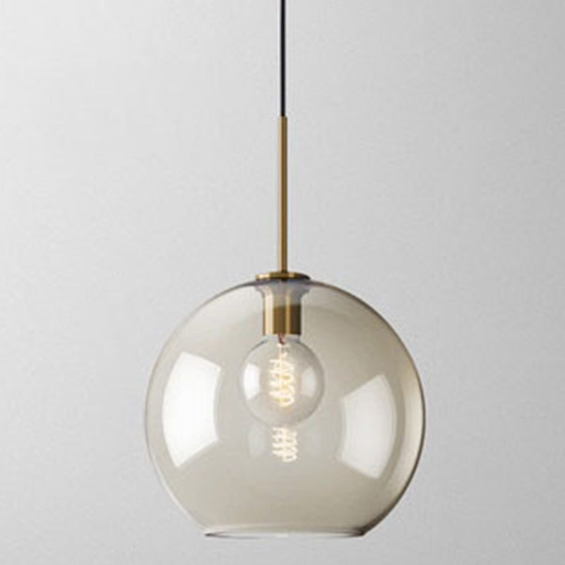 Studio shot of the largest amber glass globe shade lit warm