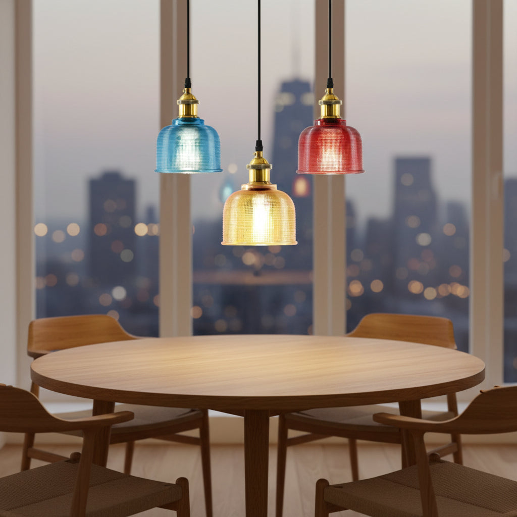 Blue, amber and red bell pendants shown together on white