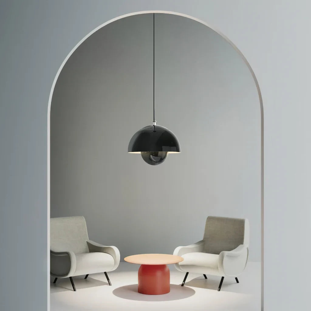 Bud metal pendant light near an entryway with warm ambient light