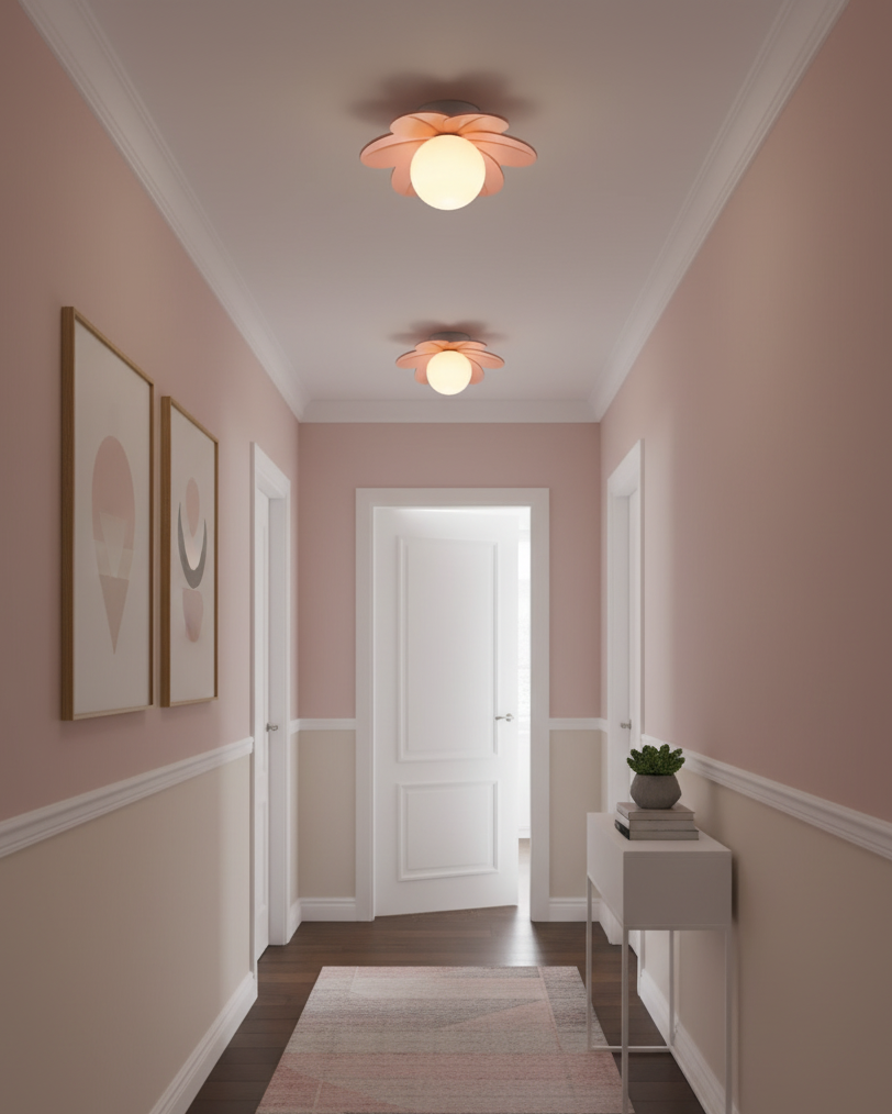 Flower ceiling lights above a soft pink hallway with framed art and a runner