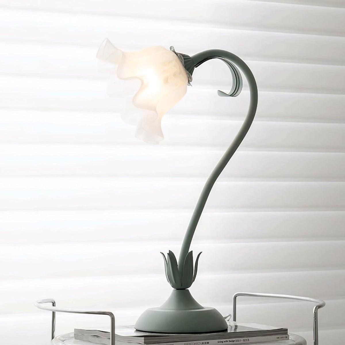 Unlit ruffled shade showing its frosted translucent petal folds and green calyx collar