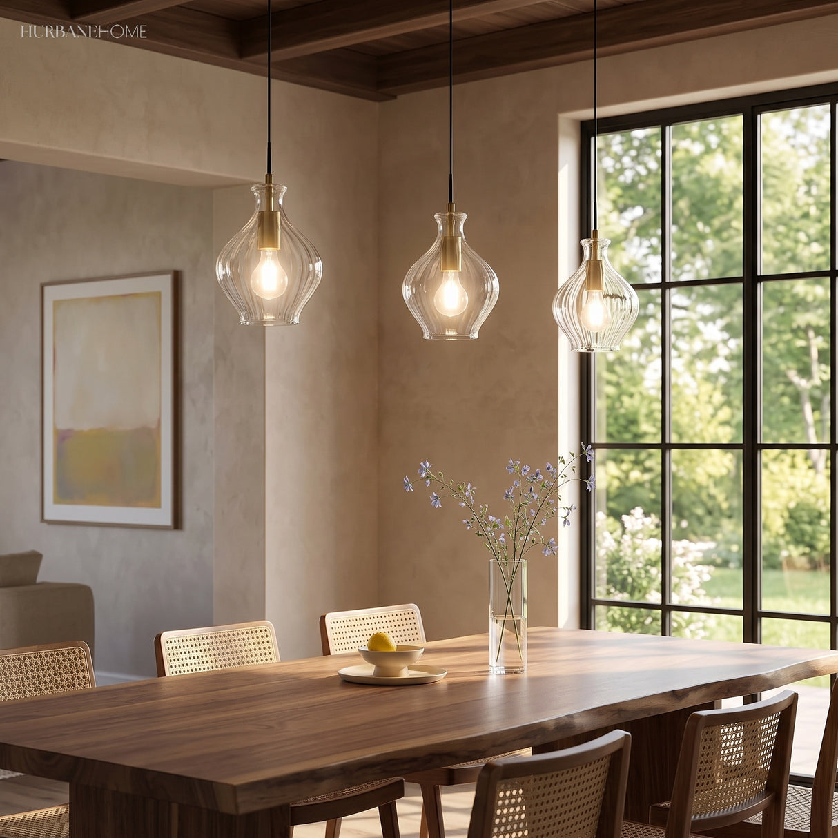 Cluster of fluted glass pendants above a walnut table and cane chairs